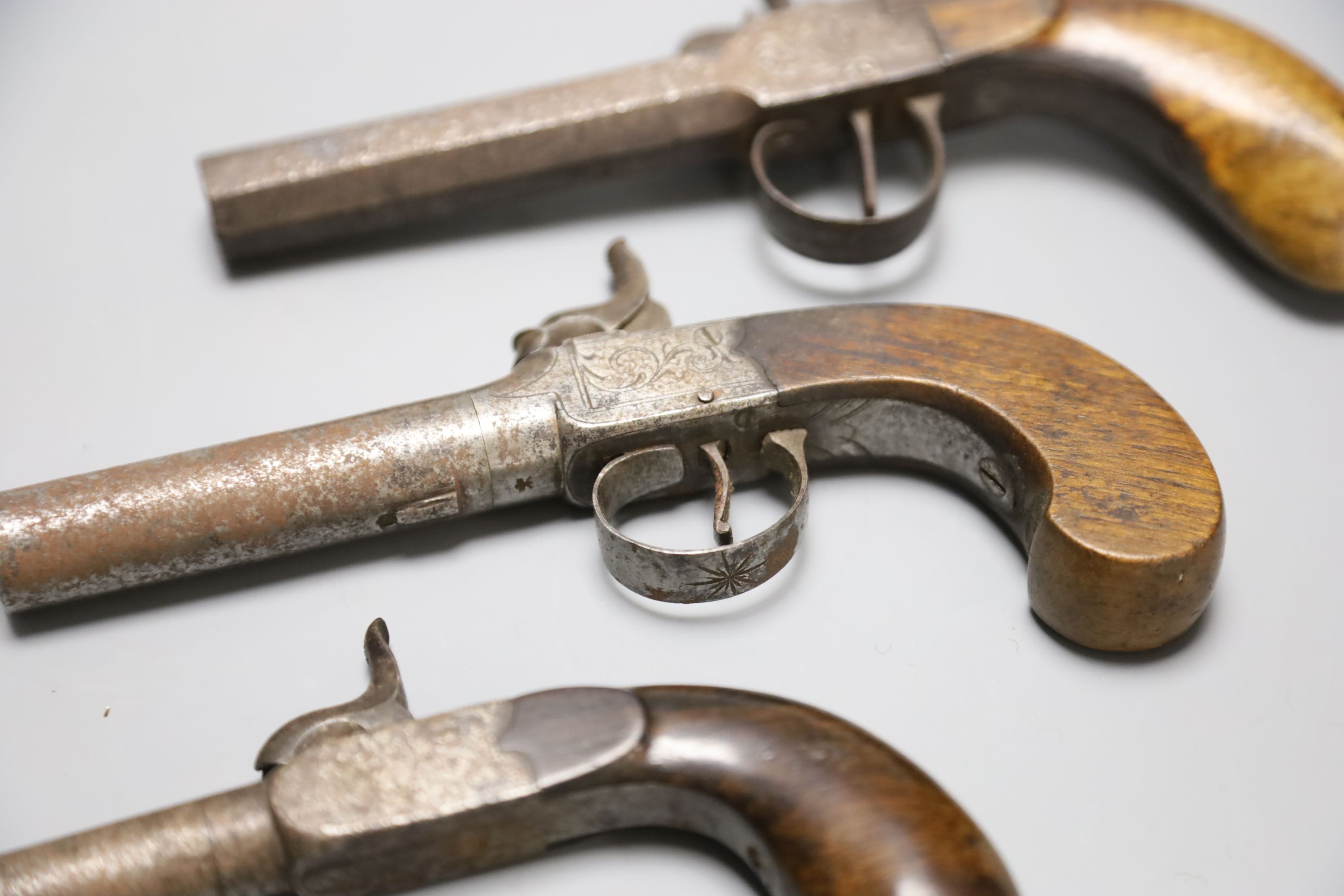 A Wilson of London box lock percussion cap pistol and two others